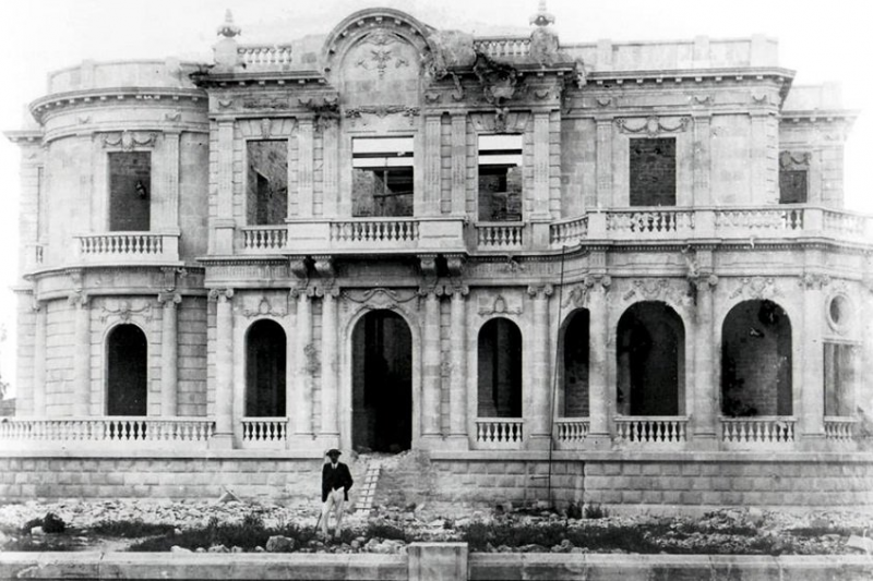 Pilavakis in front of his under construction mansion.