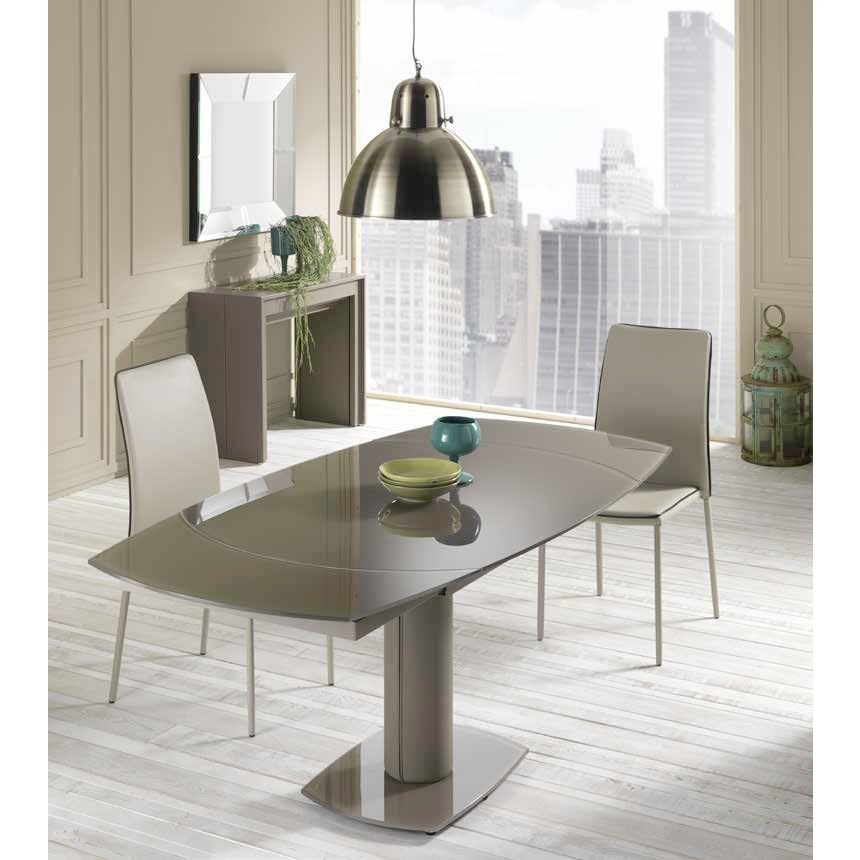 Elegant and refined extendable glass table retains the same outstanding rotating opening mechanism!
