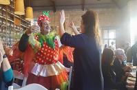 The Mayor served the people dressed as a strawberry!