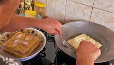 The village women make traditional delicacies.