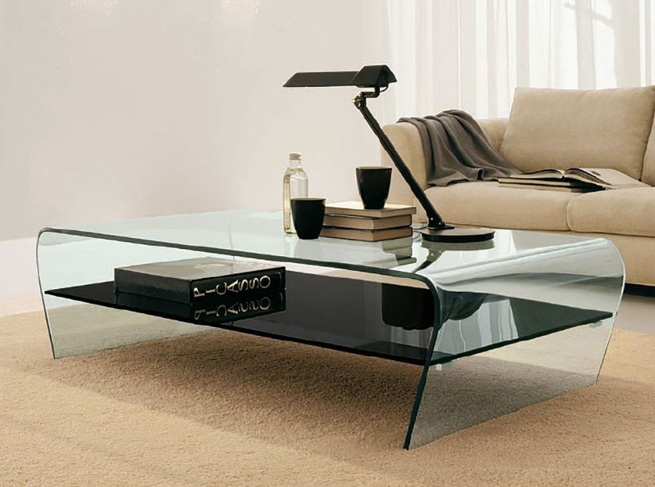 A coffee table that combines the lightness of curved glass, with a tempered glass, or wooden shelf